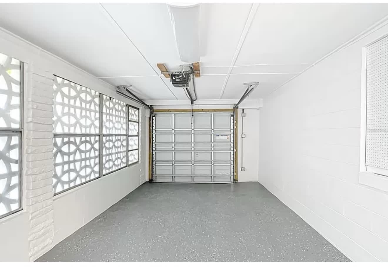 Finished garage interior with a durable gray epoxy floor